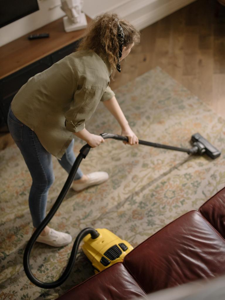 woman cleaning the carpet