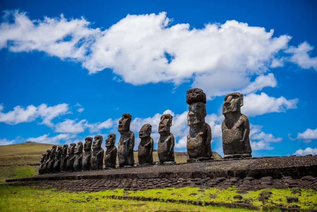 Tall rock statues under a blue sky.