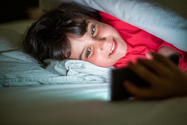 girl lying on bed smiling